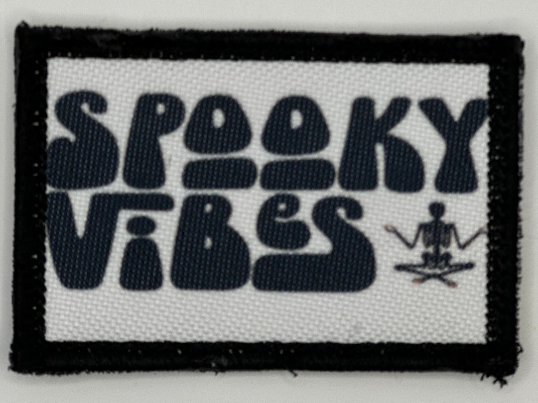 a patch with the words spooky vibes on it