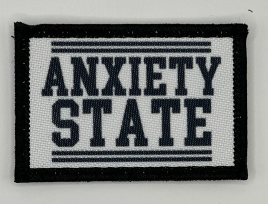 a black and white patch that says,&#39;anxiety state &#39;