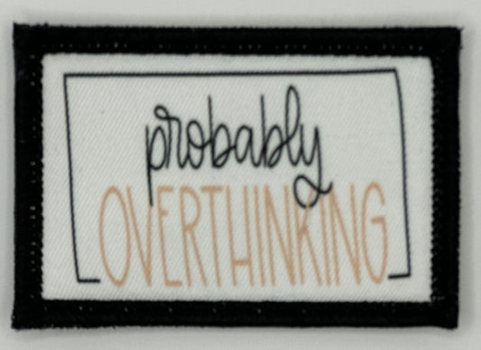 a patch with the words probably overthing on it