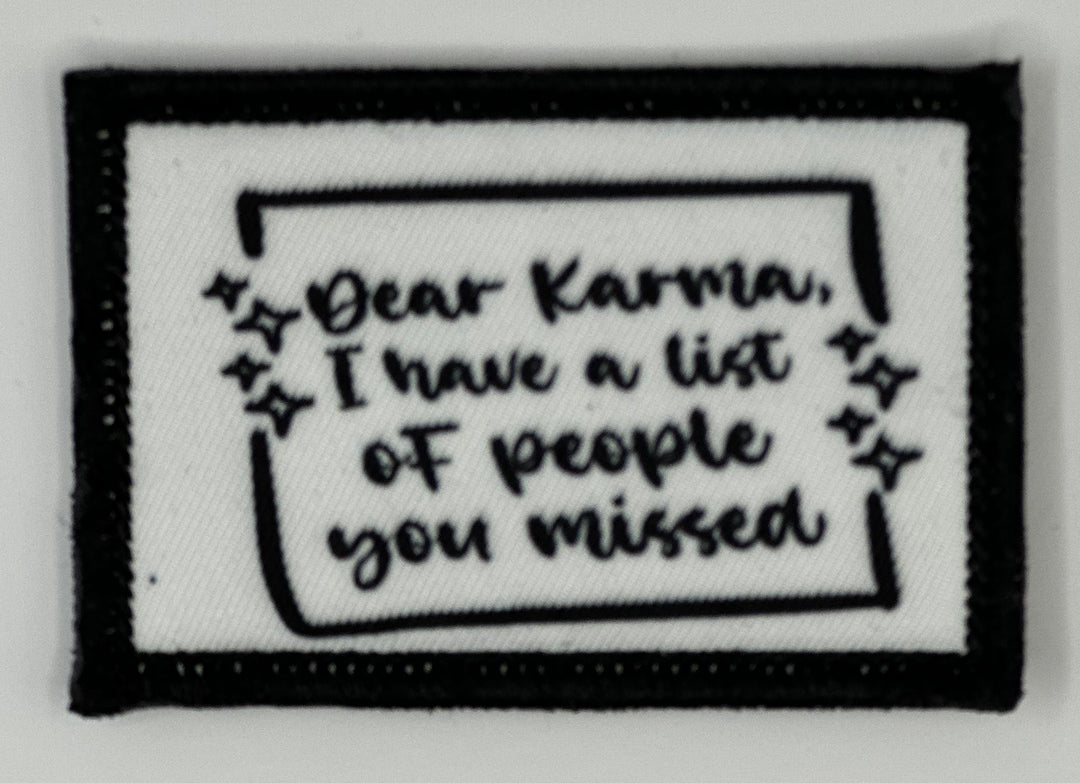 a black and white patch with a quote on it