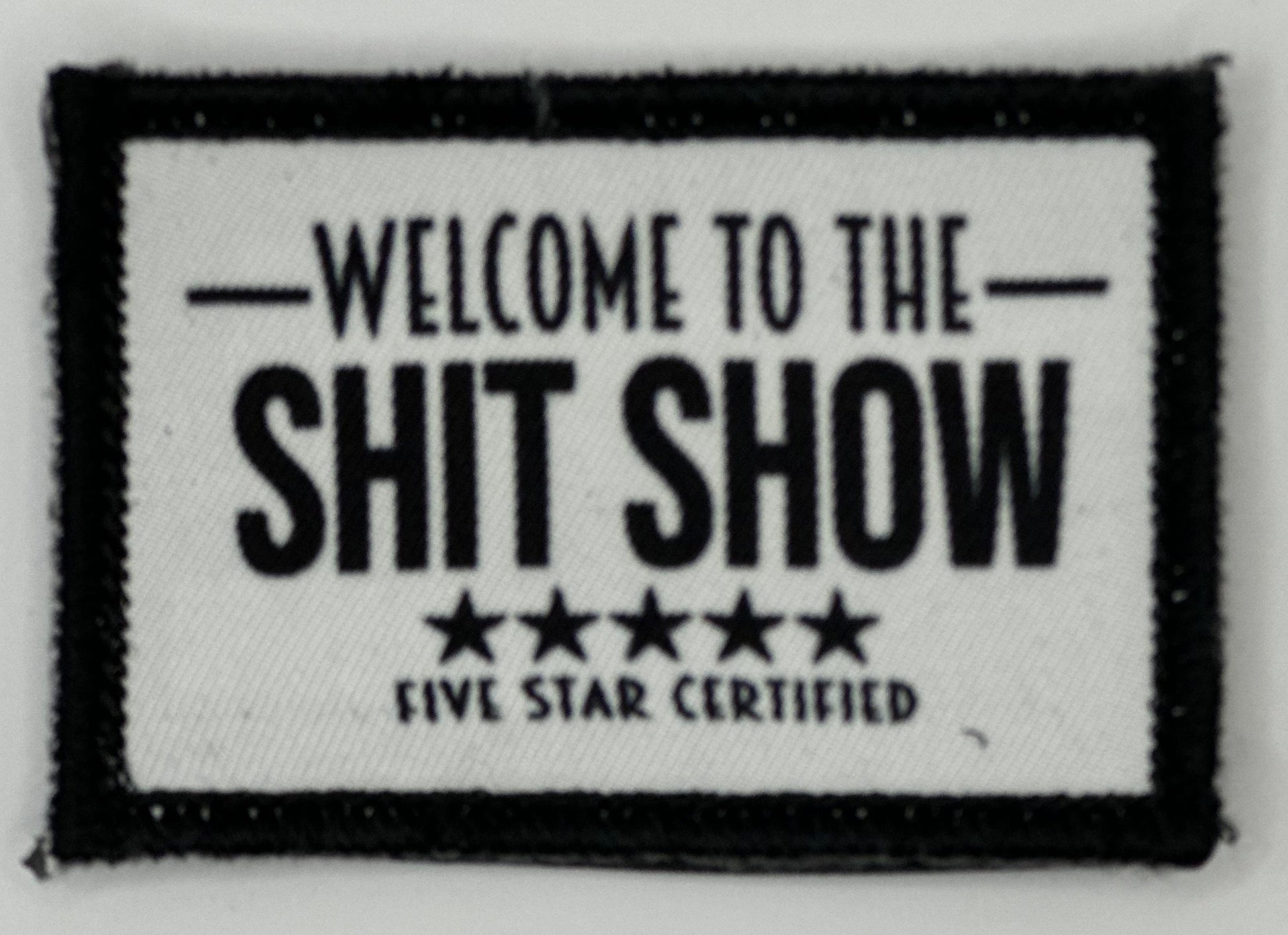 a black and white sign that says, welcome to the shit show five star certified