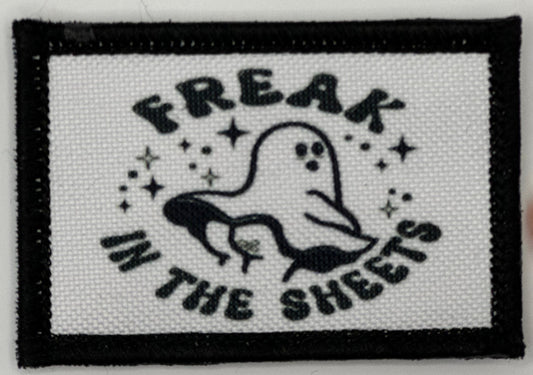 a white and black patch with the words freak in the sheets