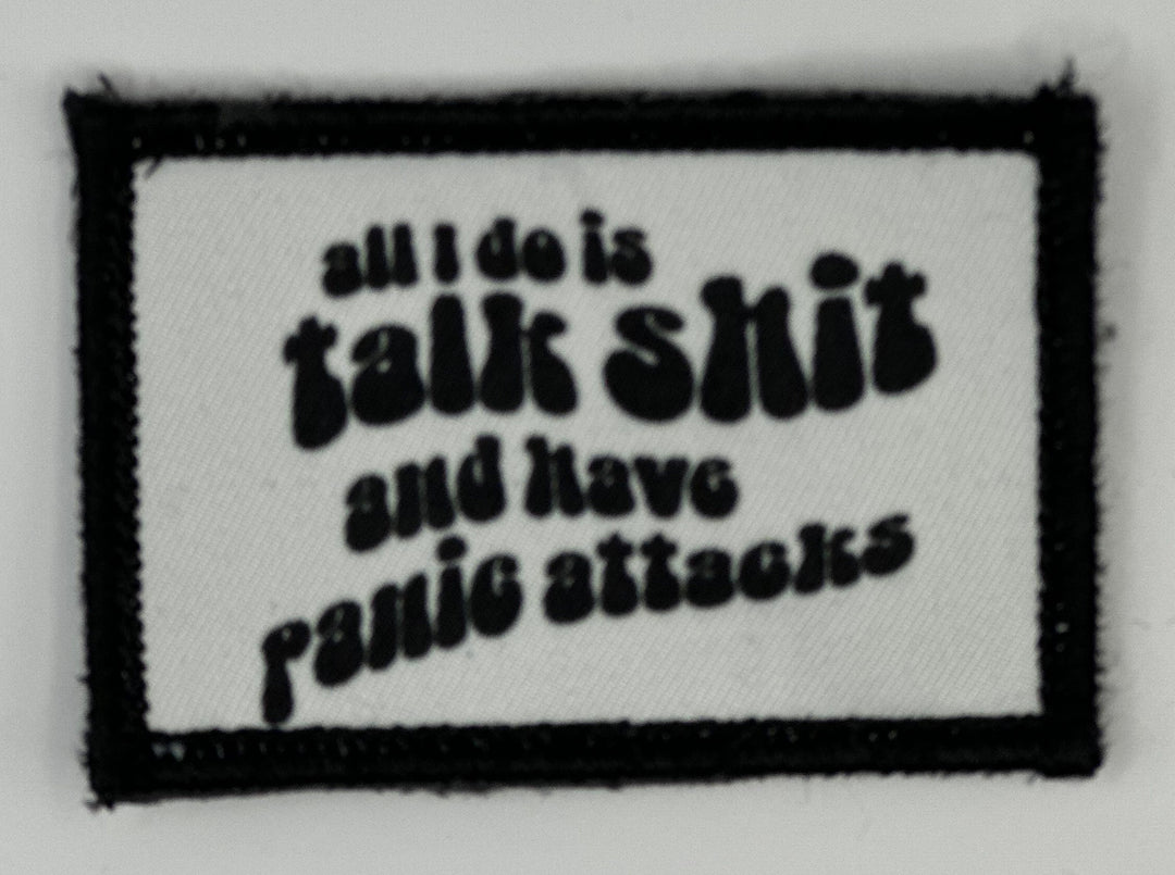 a black and white patch with a quote on it