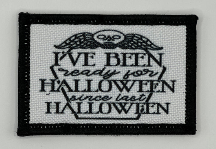 a black and white embroidered patch with a quote on it