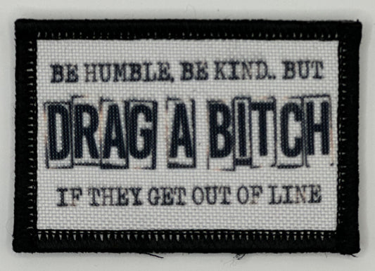 a white and black patch with words on it