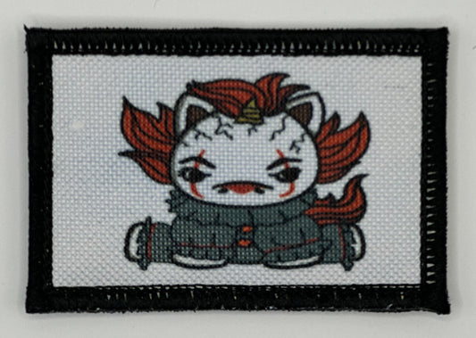 a cross stitch picture of a cat with red hair