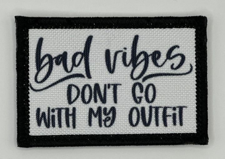 a black and white patch that says bad vibes don&#39;t go with my