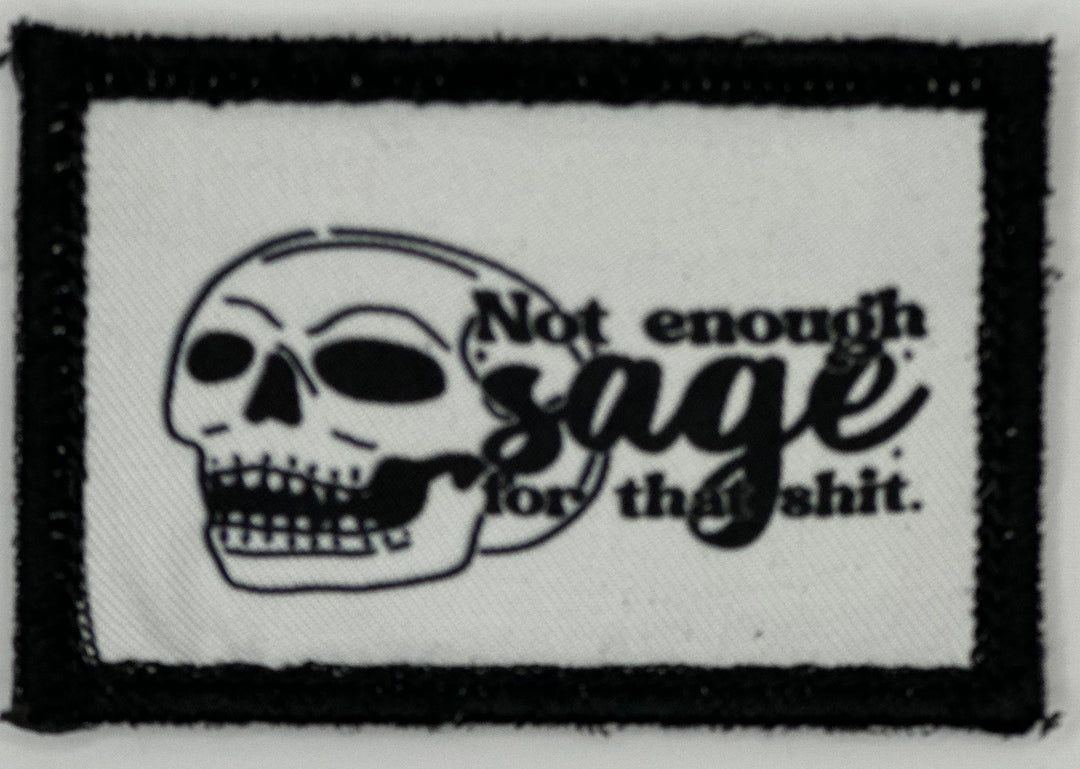 a black and white patch with a skull on it