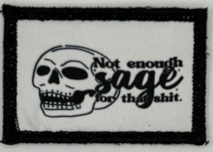 a black and white patch with a skull on it