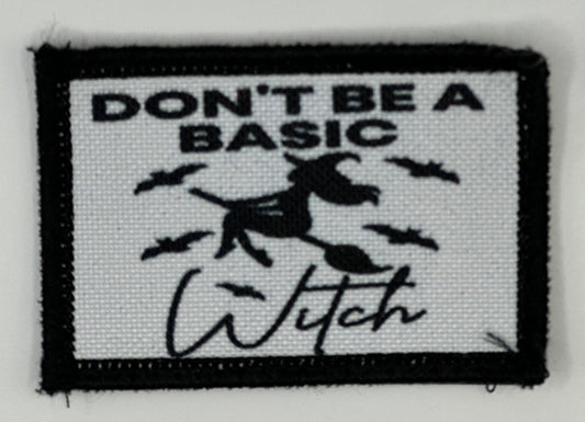 a black and white patch with a witch saying don&#39;t be a basic witch