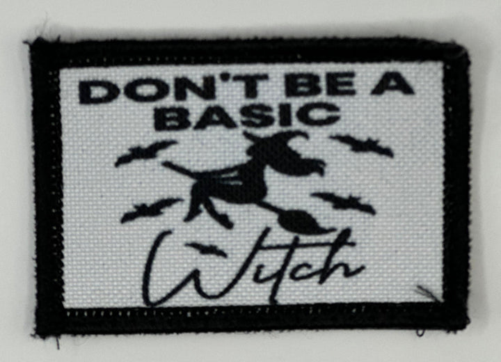 a black and white patch with a witch saying don&#39;t be a basic witch