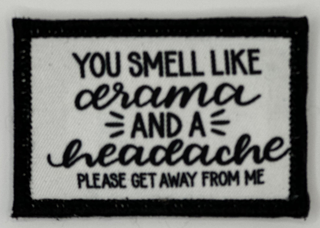 a black and white patch with a quote on it