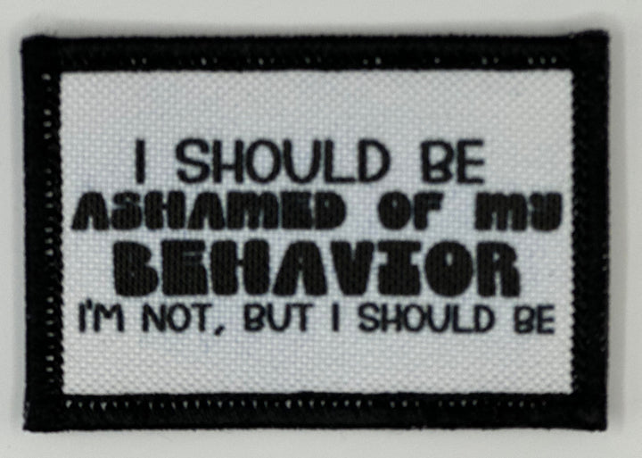 a black and white patch with a quote on it