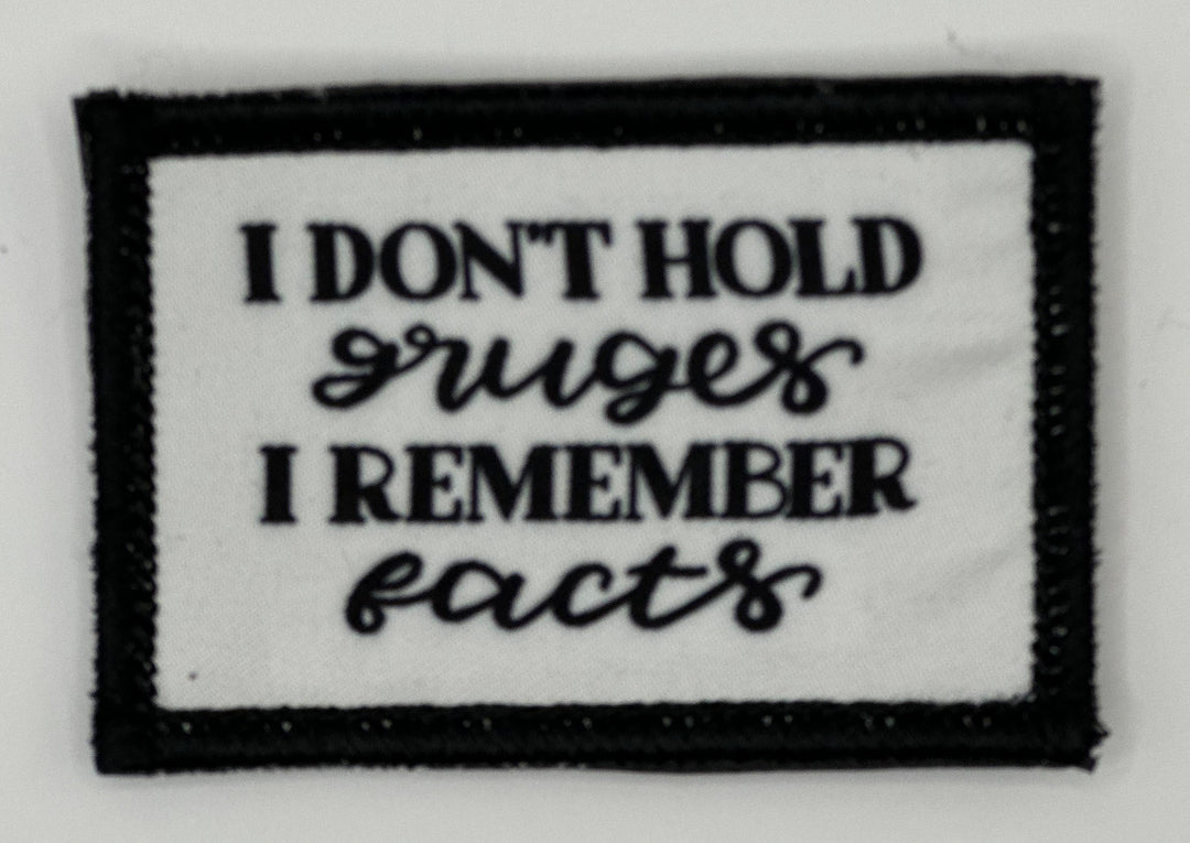 a black and white patch with words on it