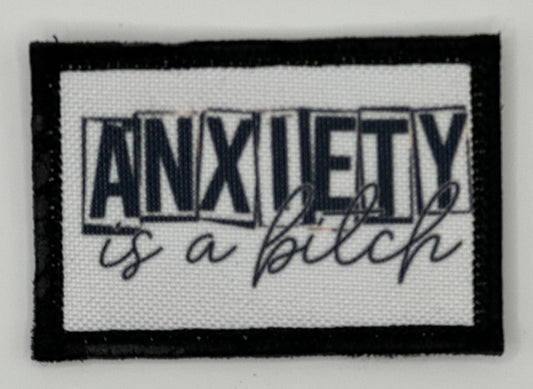 a black and white patch with an inscription on it