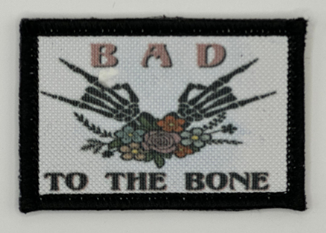 a picture of a patch with the words bad to the bone on it