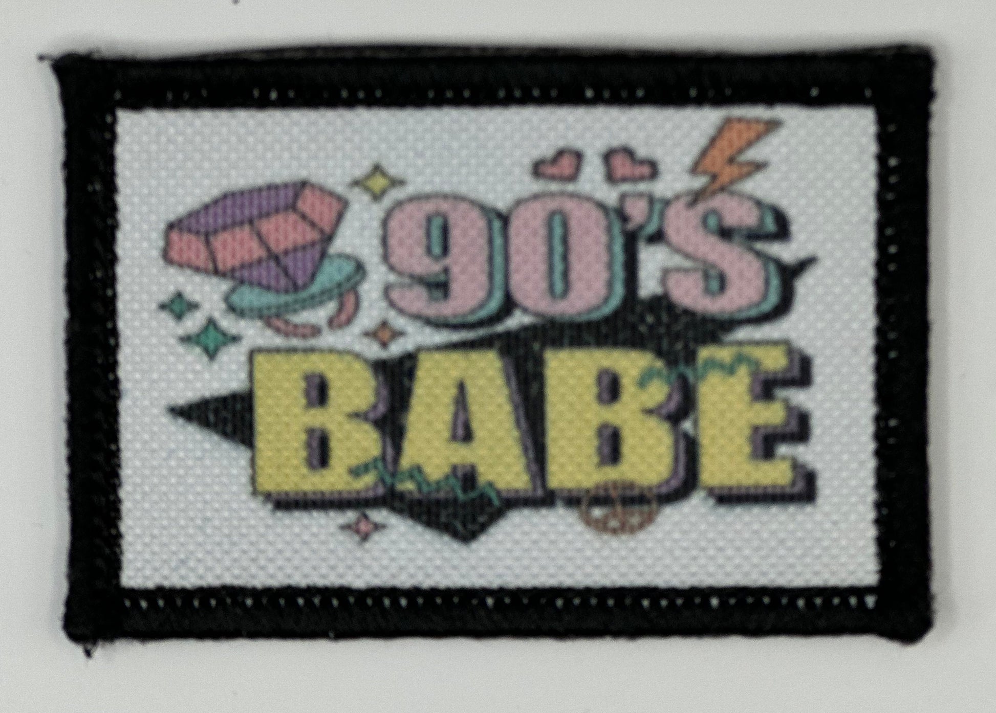 a patch with the words 90&#39;s babe on it