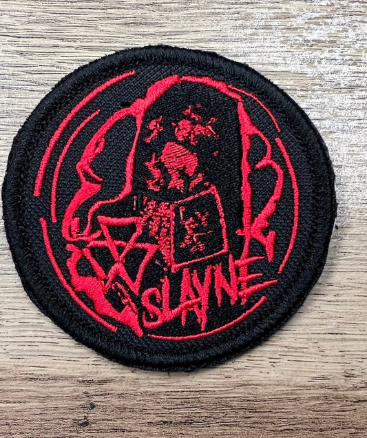 Black and red patch with Slayne character on it