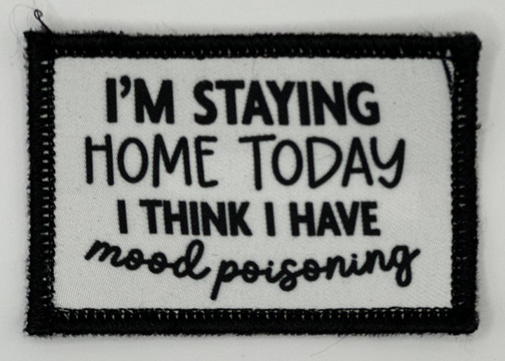 a black and white patch with a quote on it