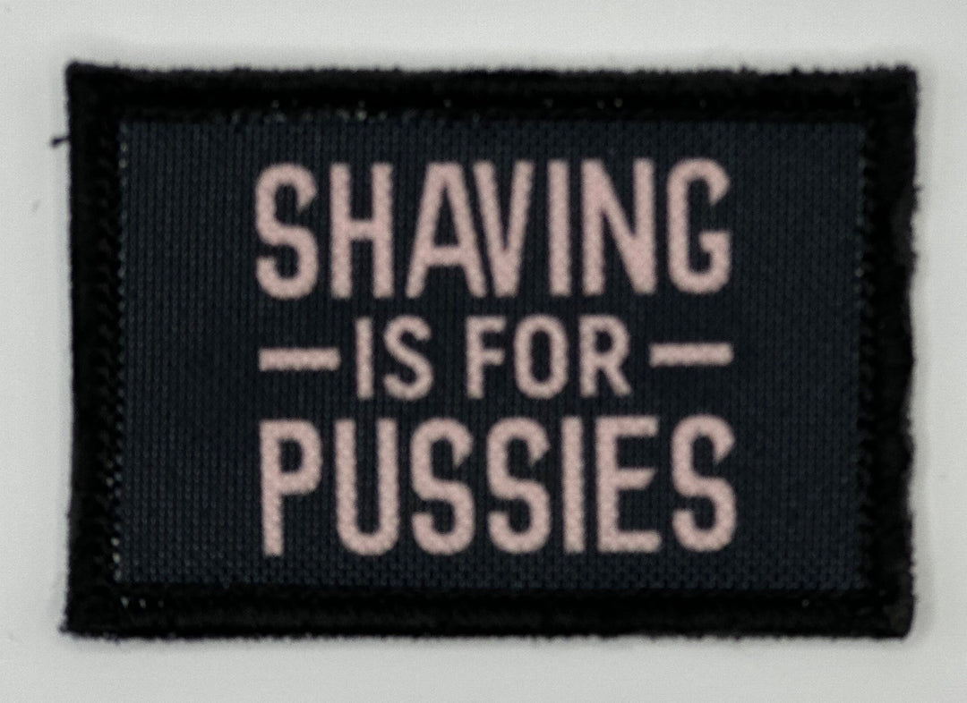 a black and white sign that says shaving is for pusses