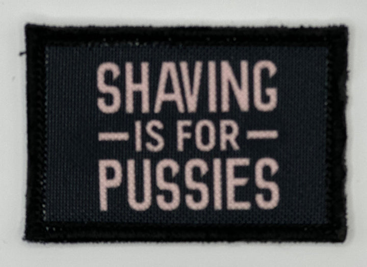 a black and white sign that says shaving is for pusses