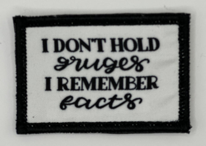 a black and white patch with words on it