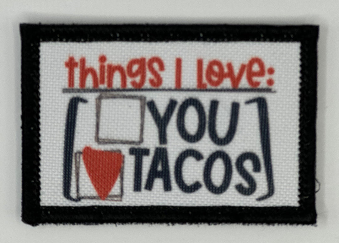 a white and black patch with the words things i love you tacos