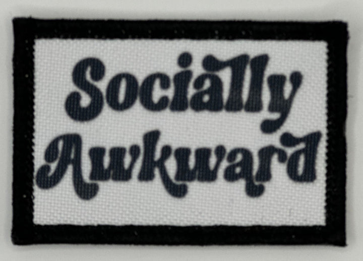 a black and white patch that says socially awkward