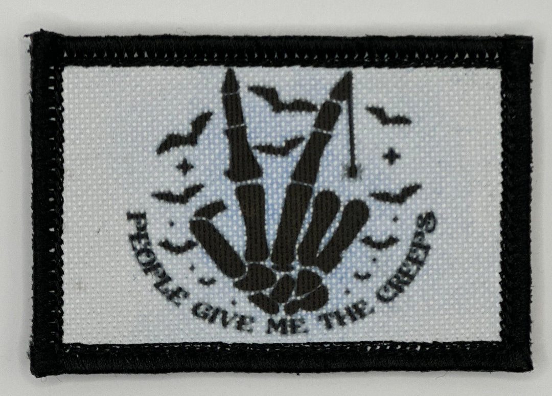 a white and black patch with a black border