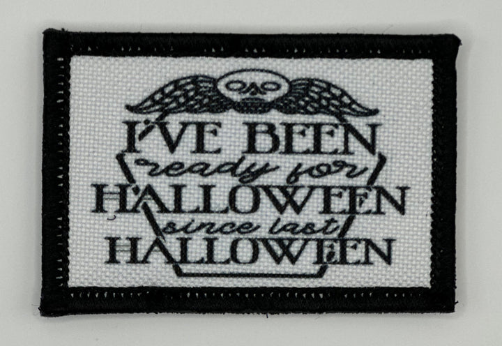 a black and white embroidered patch with a quote on it