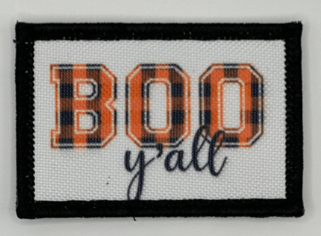 a picture of a black and white patch with the word boo y&#39;all on