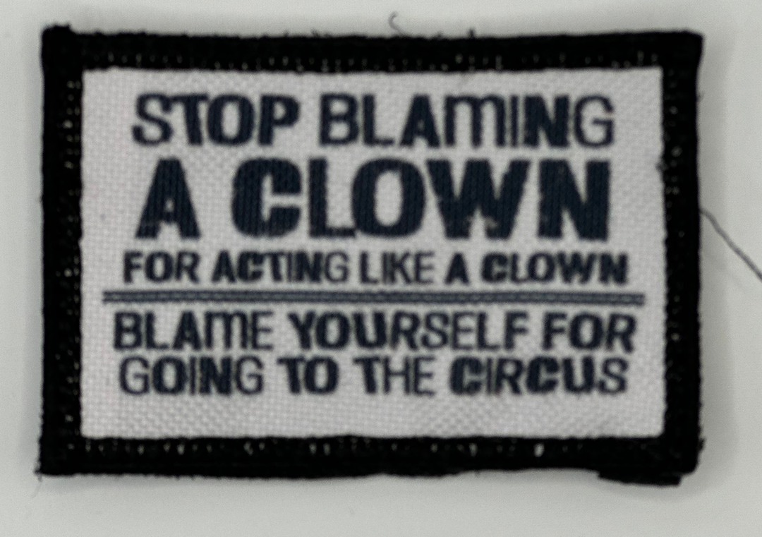 a black and white sign that says stop blaming a clown for acting like