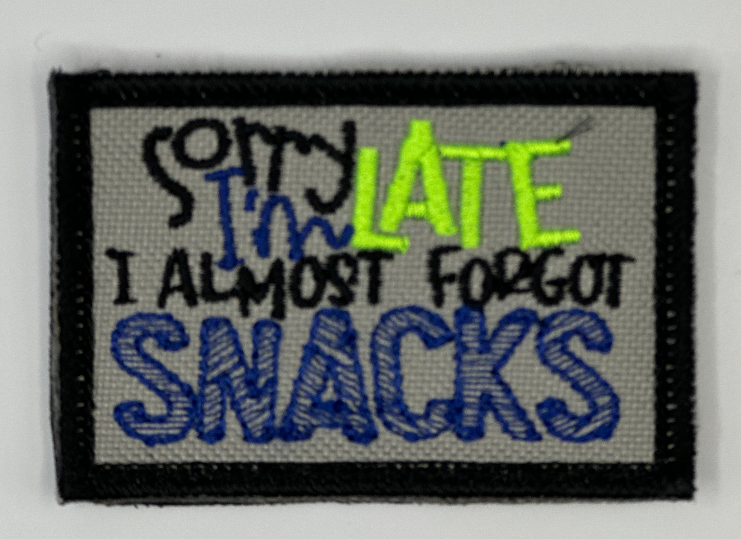 a patch with a message on it that says, sorry late i almost forgot snacks