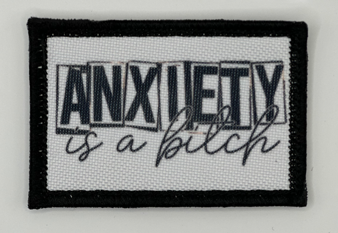 a black and white patch with an inscription on it