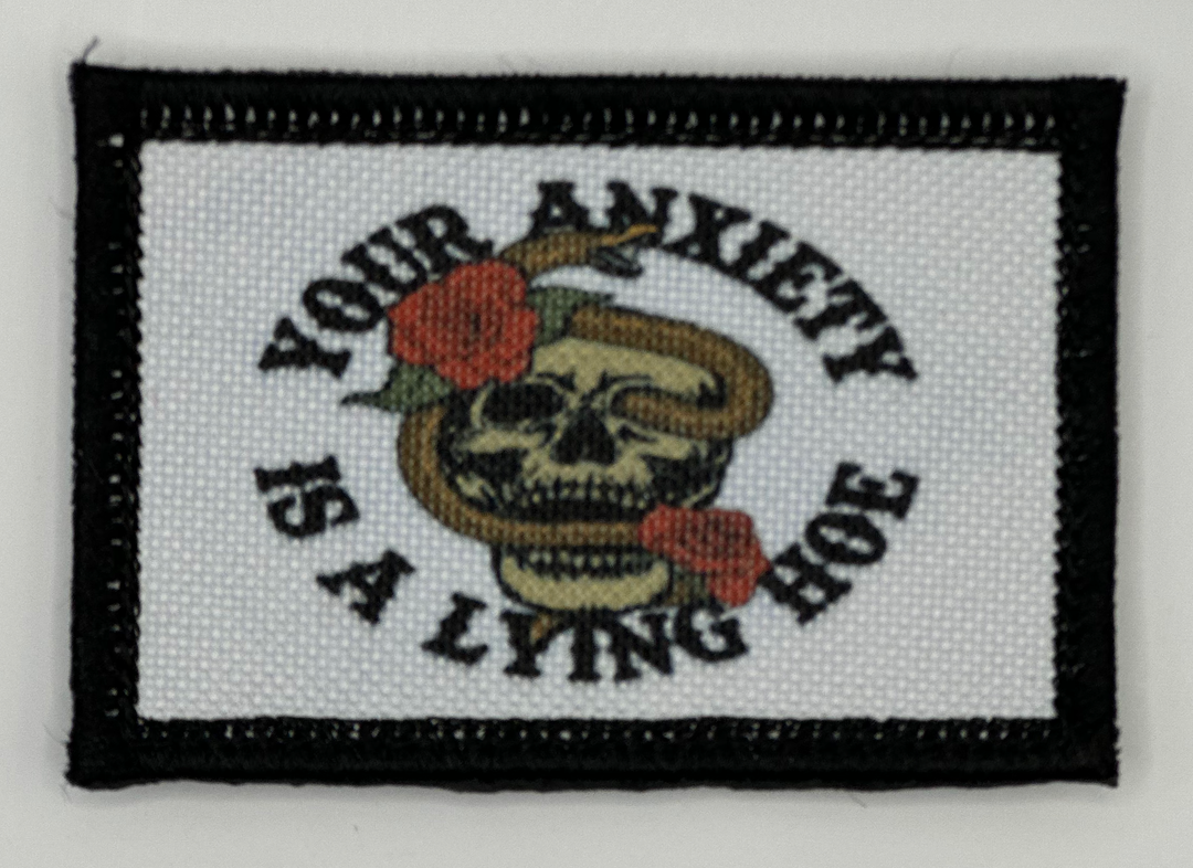 a patch with a skull and a rose on it