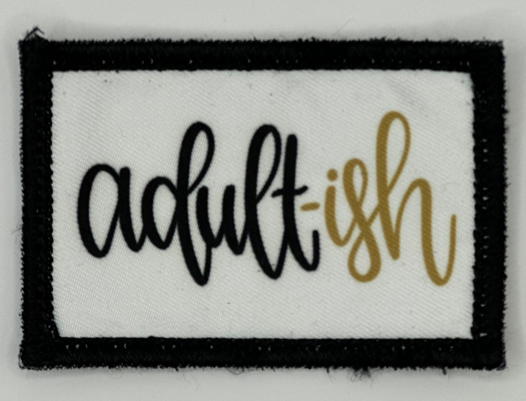 a black and white patch with the words adult fish on it