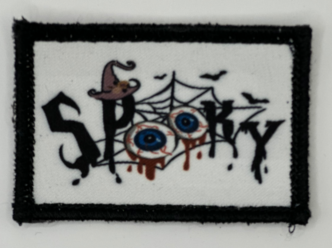 a patch with the word spooky painted on it