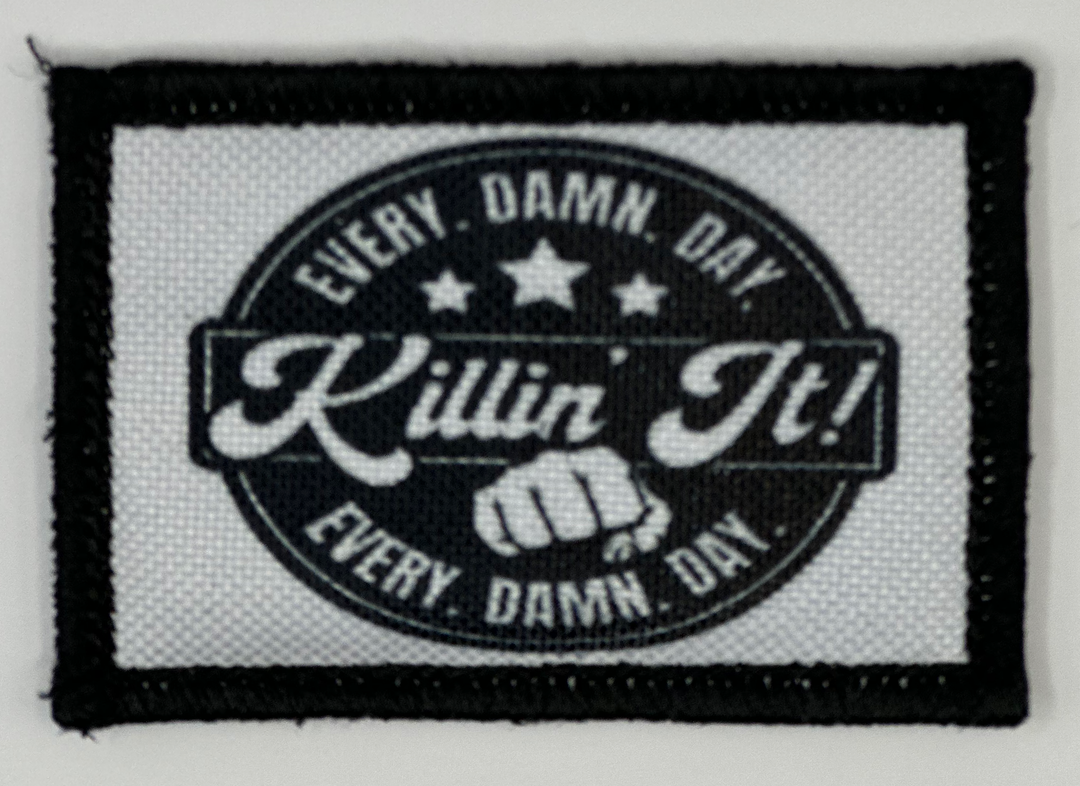 a black and white patch that says every damn day