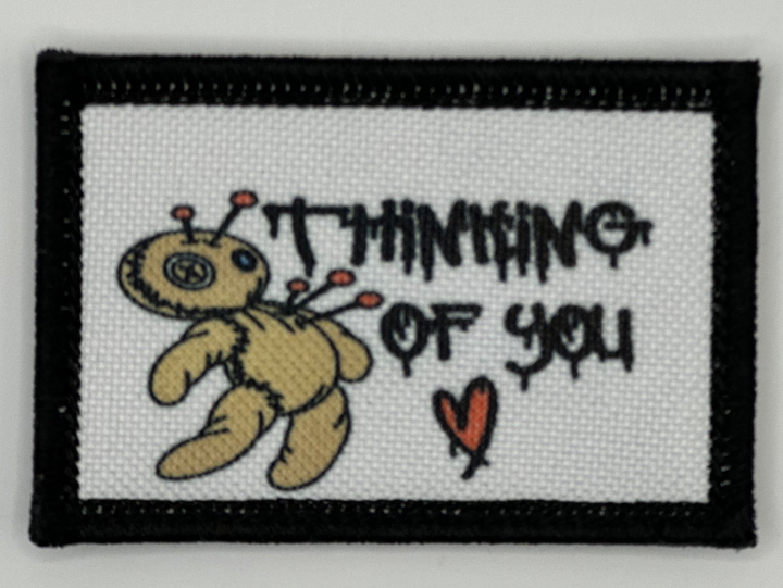 a picture of a teddy bear with the words thinking of you on it