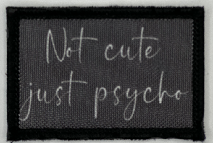a black and white picture of a sign that says not cute just psycho