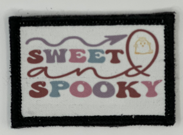 a patch with the words sweet spooky on it