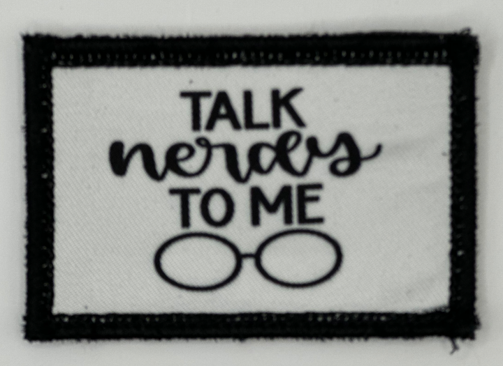 a patch with the words talk nerdys to me on it