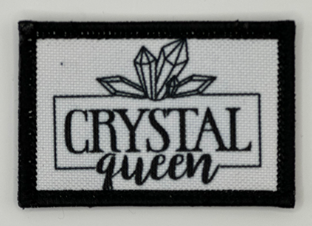 a black and white patch with the words crystal queen on it