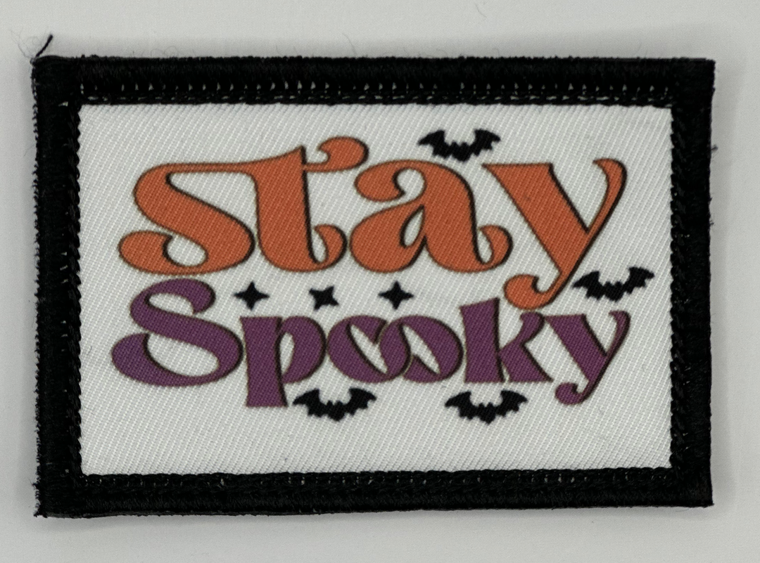 a patch that says stay spooky on it