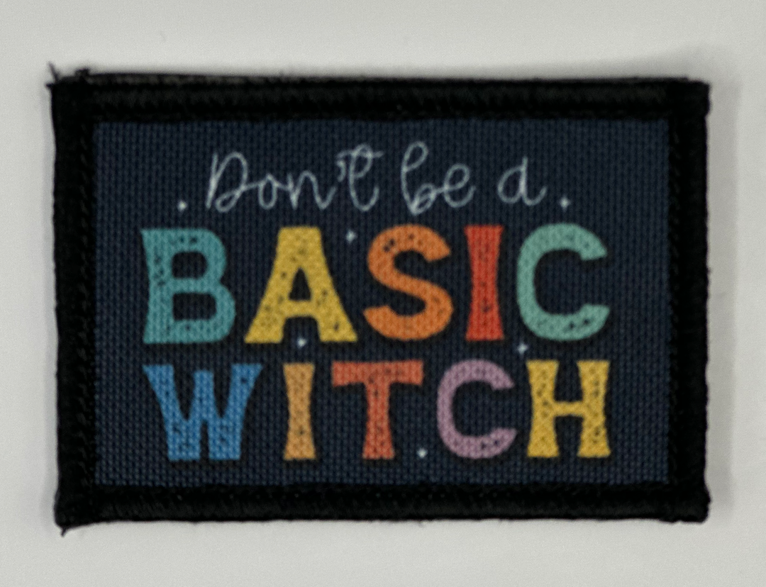 a picture of a sign that says don't be a basic witch