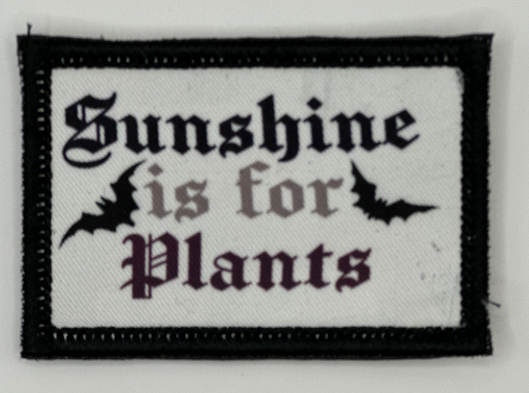 a patch that says sunshine is for plants