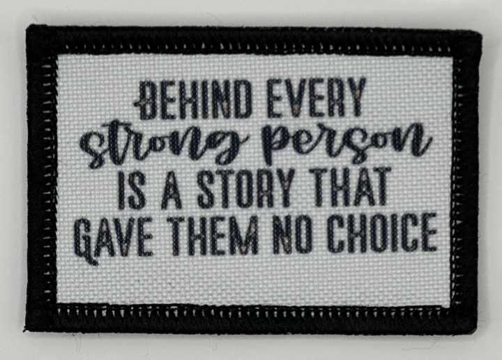 a black and white patch with a quote on it