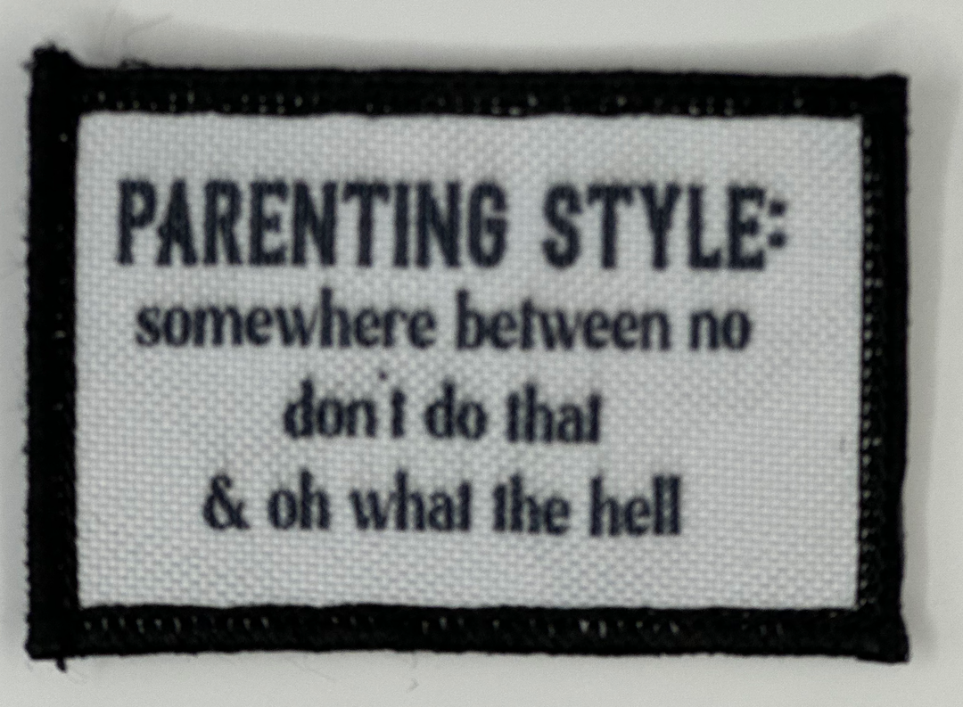 a white and black patch with a quote on it