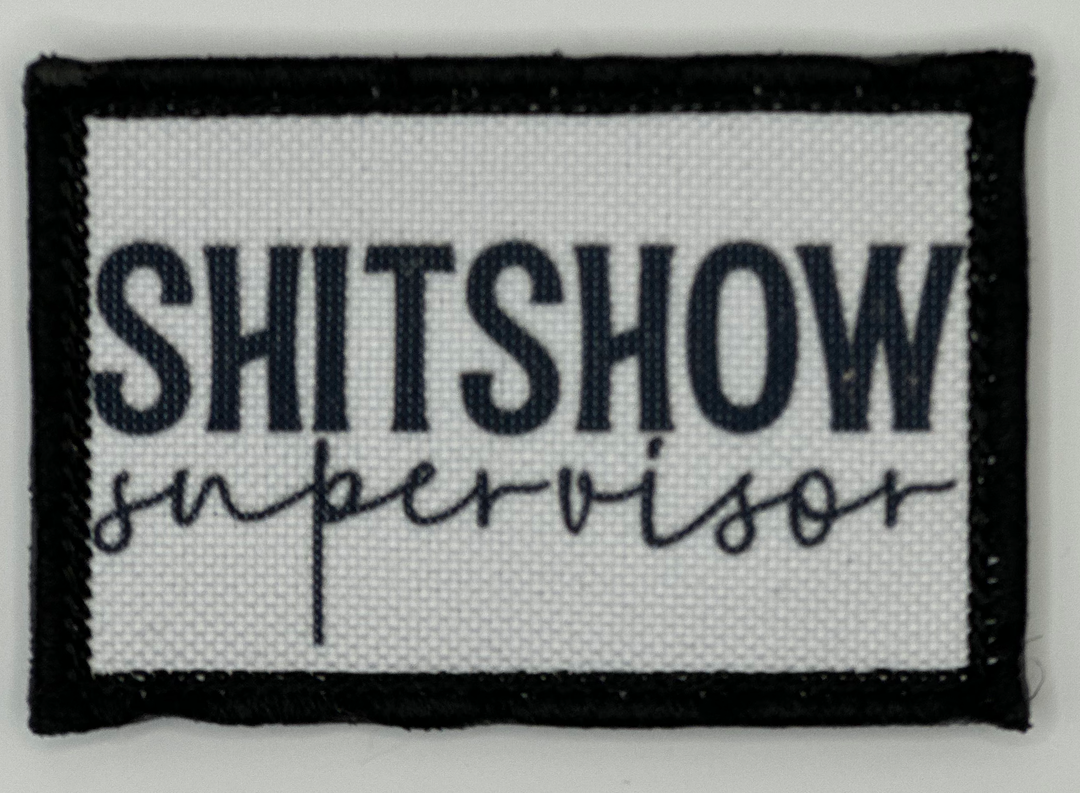 a black and white patch with the words shitshow supervisor