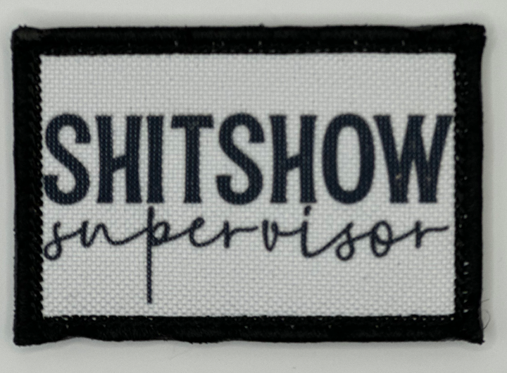a black and white patch with the words shitshow supervisor